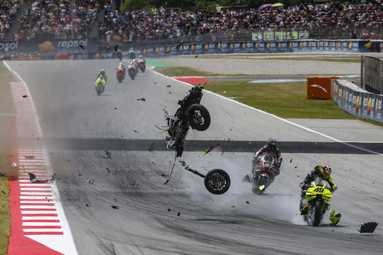 Alex Marquez' Ducati MotoGP bike flying through the air. Credit: Gold and Goose.