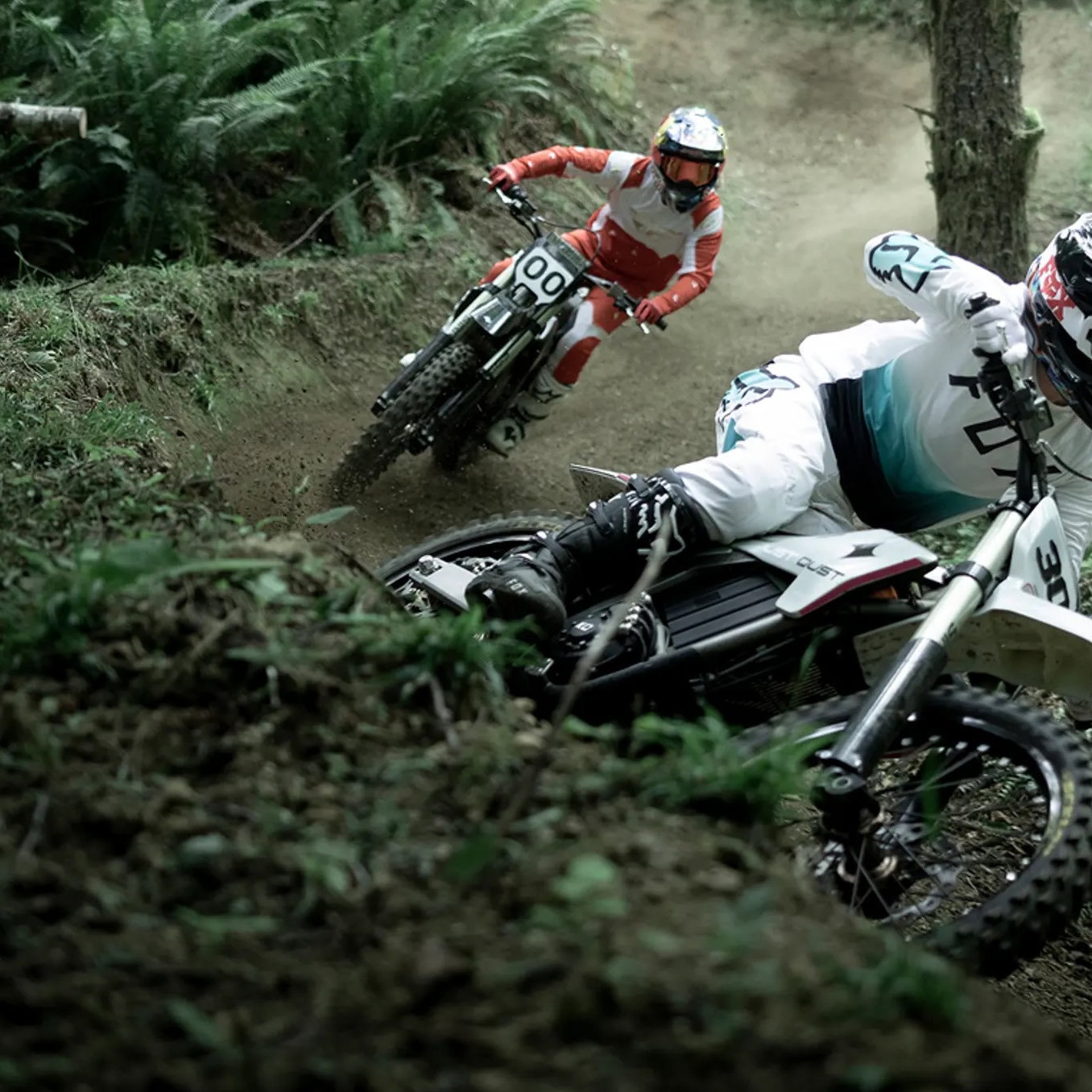 A dirst bike being ridden in woodland