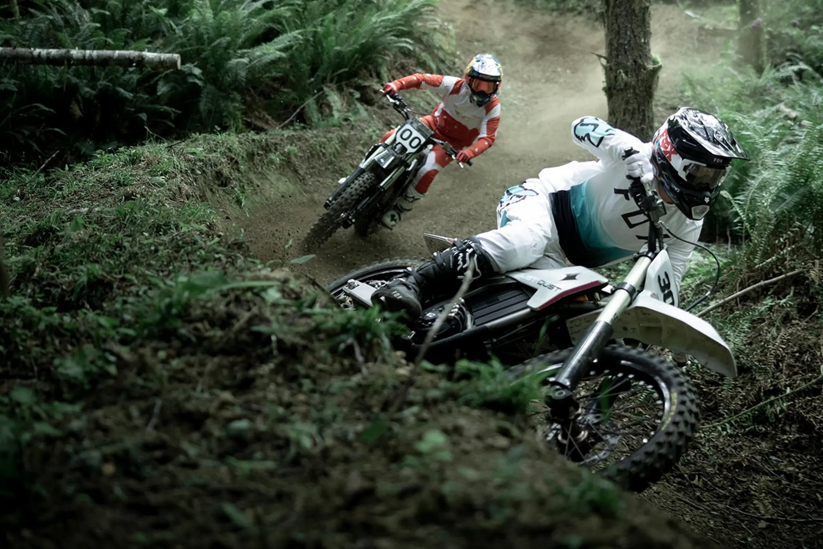 A dirst bike being ridden in woodland