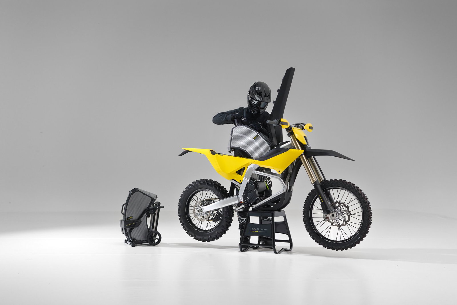 a rider changing the battery of the Radian EXR