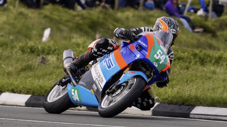 Maria Costello riding a motorcycle at the TT. Credit: Iconic Auctioneers.