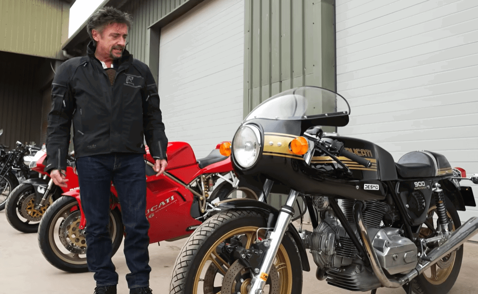 Richard Hammond standing with Ducati bikes from his collection.
