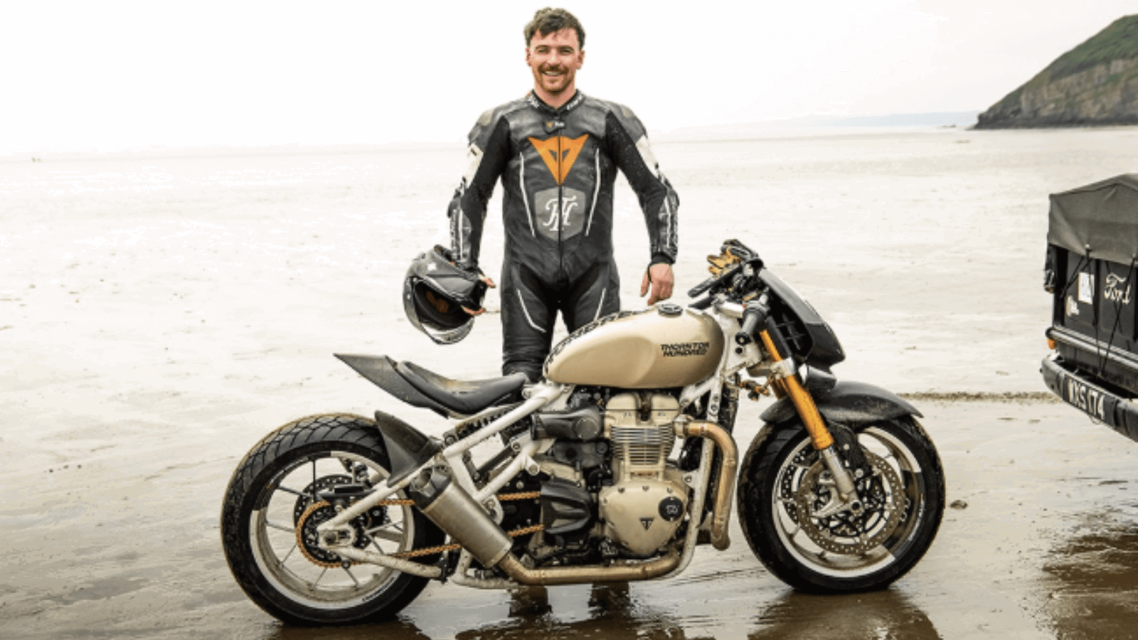 Jody Millhouse standing with the Triumph racer. Credit: Thornton Hundred Motorcycles.