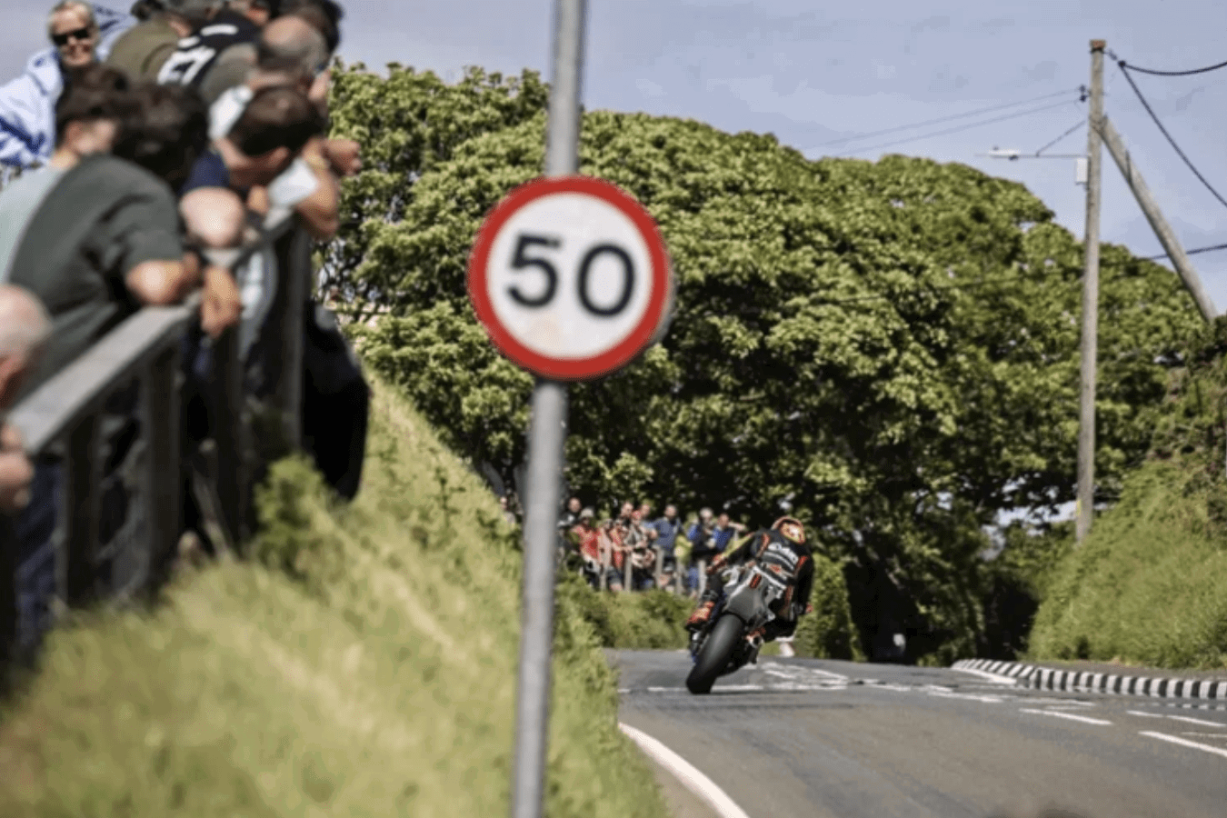 A rider and spectators at the TT. Credit: Isle of Man TT.