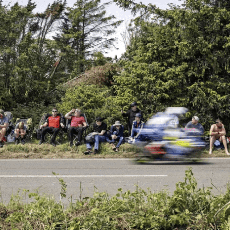 A rider flying past fans at the Isle of Man TT. Credit: Isle of Man TT.