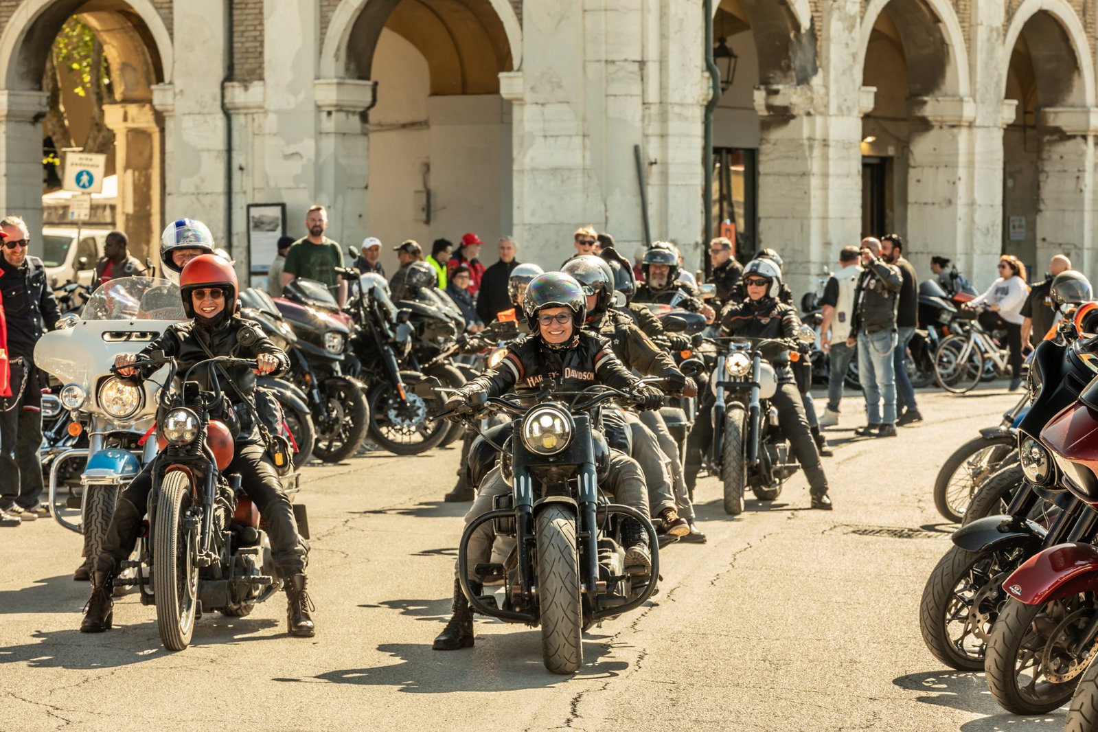 Harley-Davidson riders taking off.
