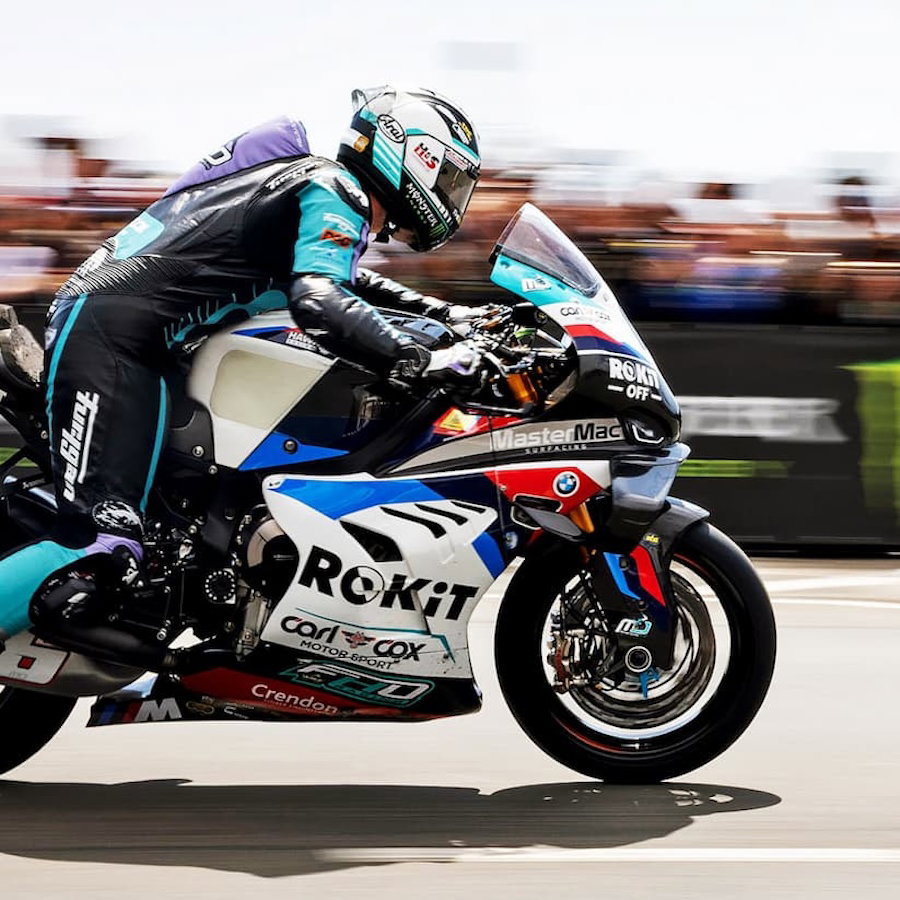 A racer leaves the start line at the TT races