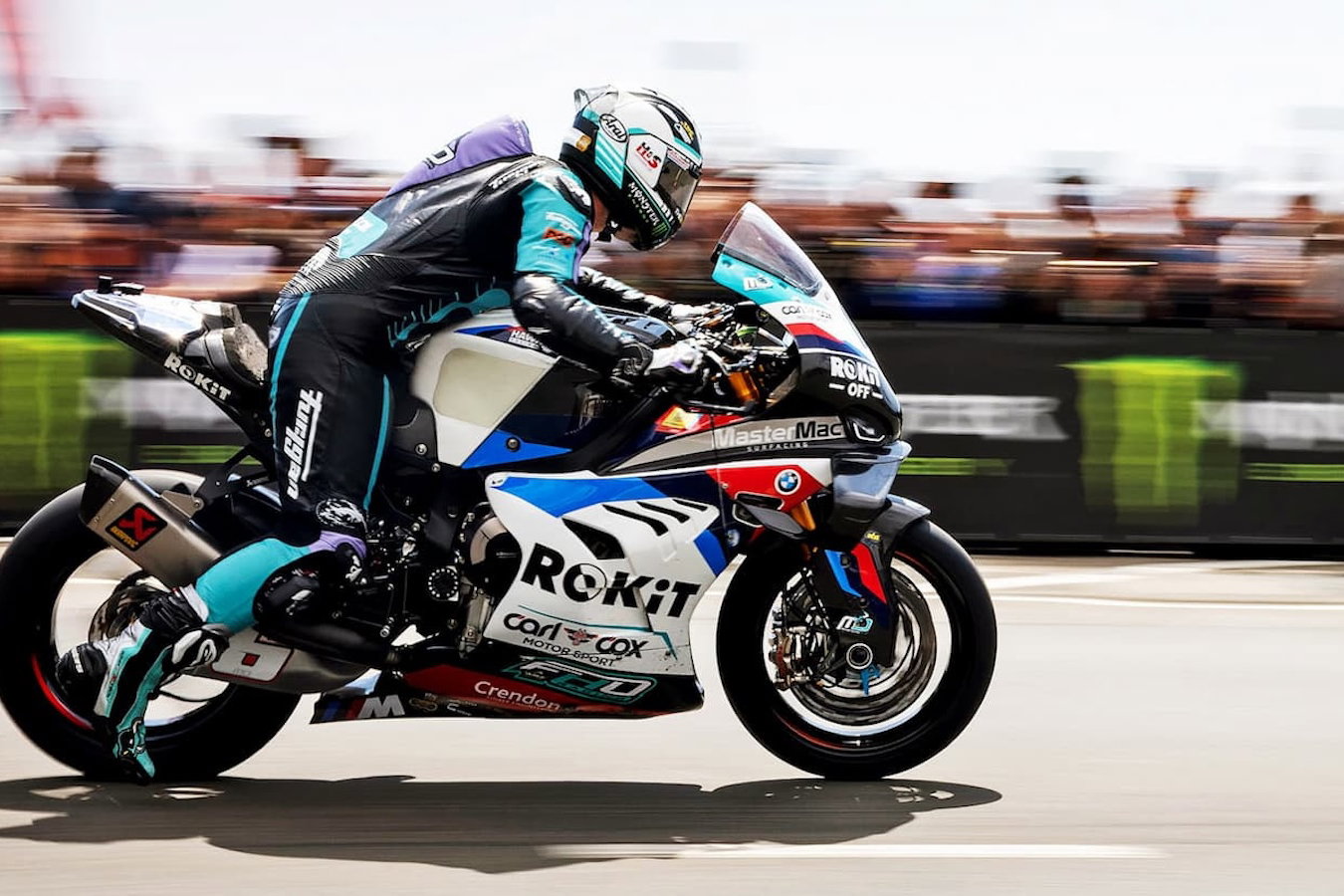 A racer leaves the start line at the TT races