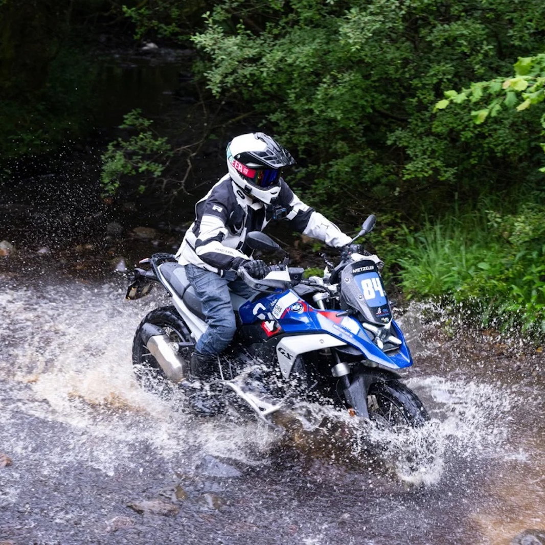 A BMW R1300 GS crossing a river