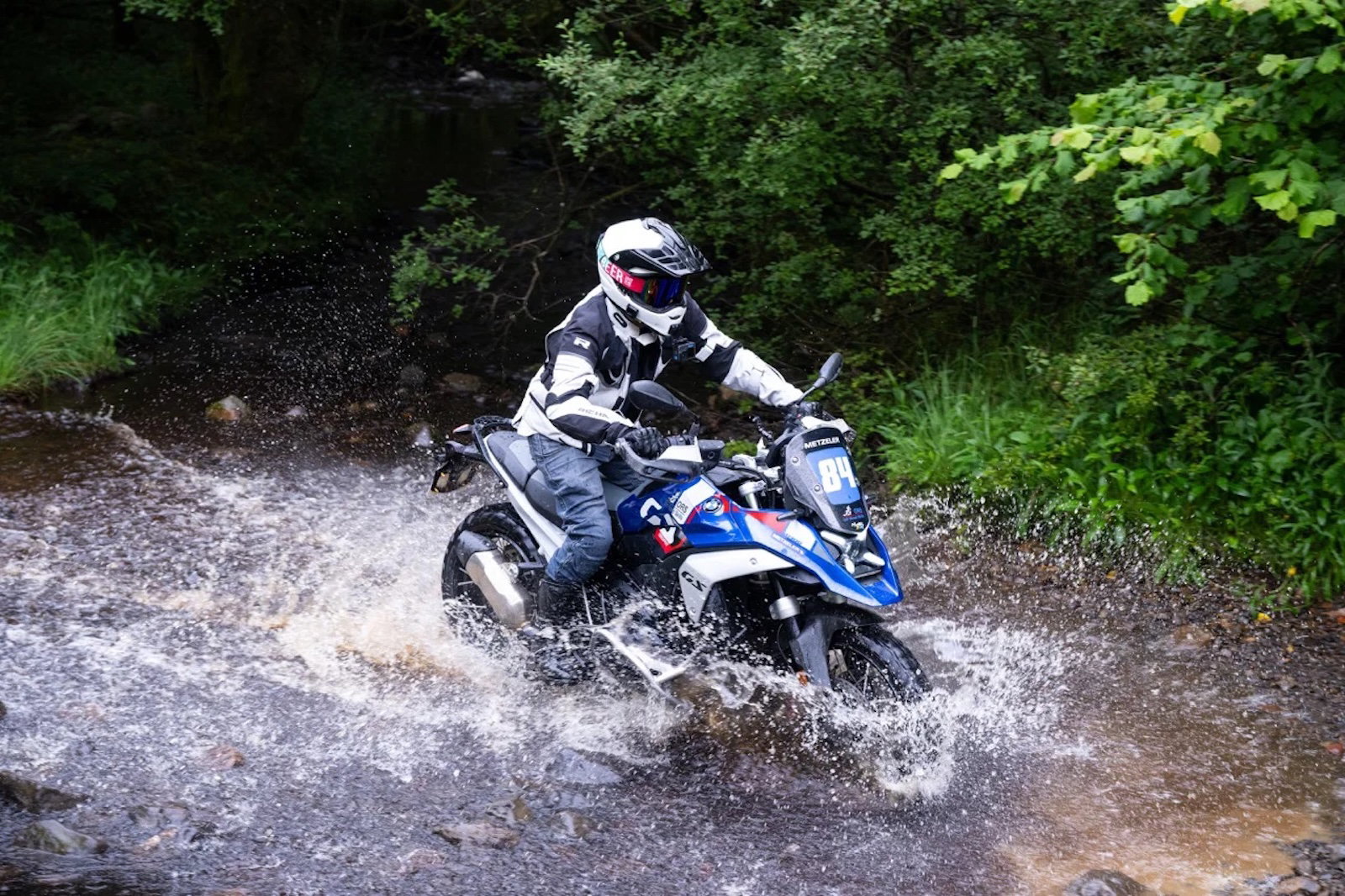 A BMW R1300 GS crossing a river