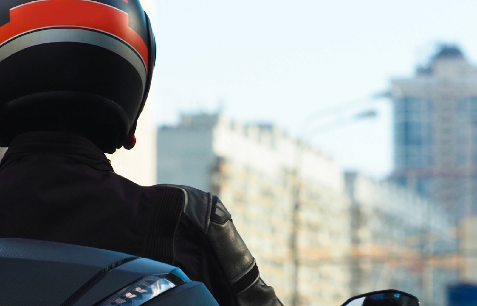 A scooter in a high rise urban environment