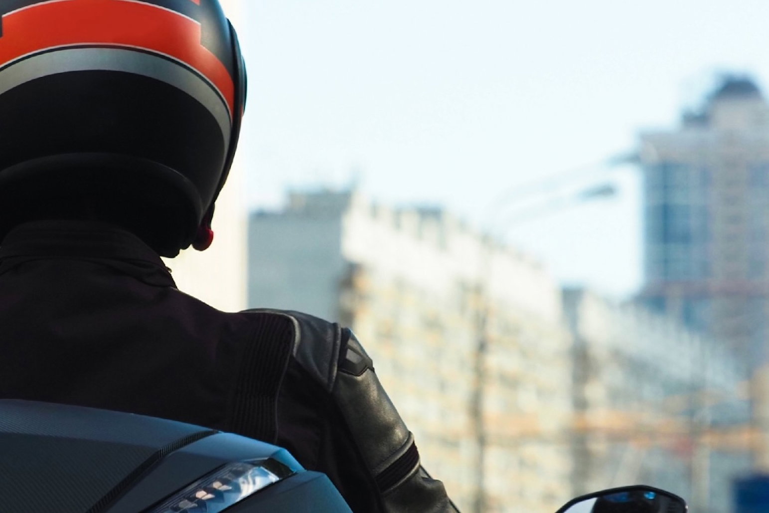 A scooter in a high rise urban environment