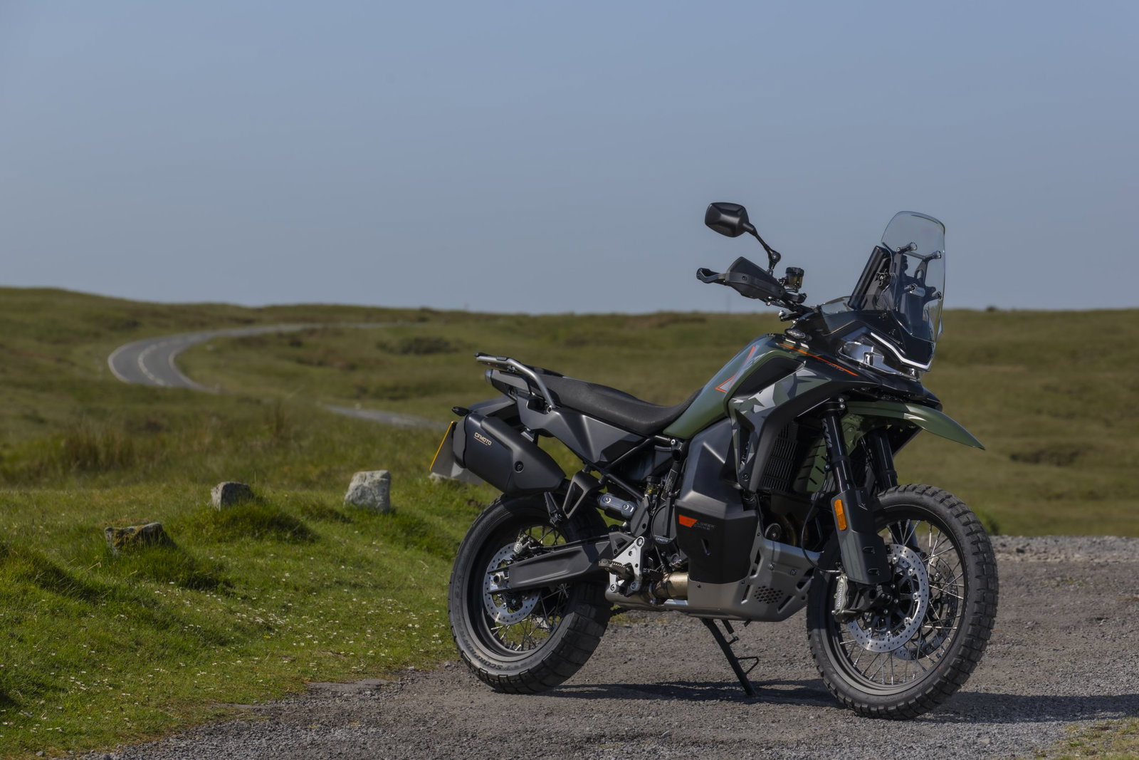 The CFMoto 1000 MT-X on a country lane
