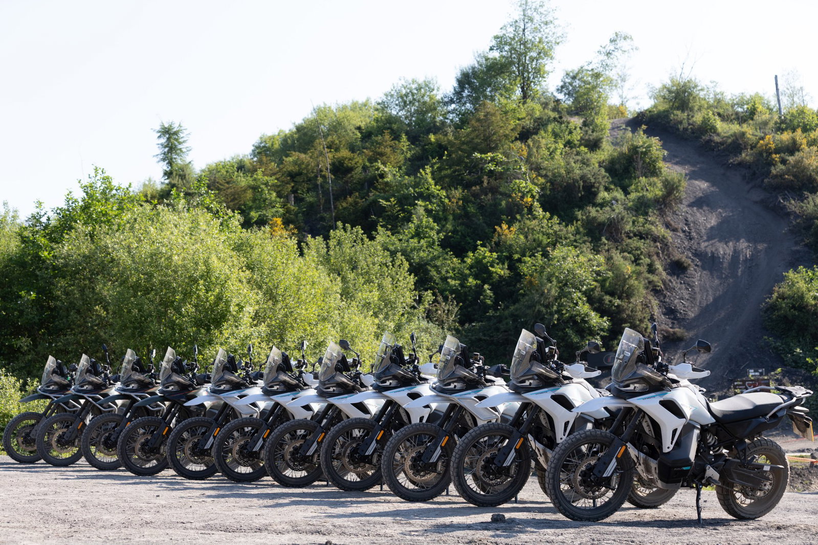 A row of CFMoto 1000MT-X adventure bikes