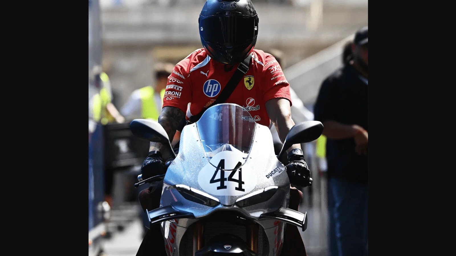 Lewis Hamilton riding a Ducati Panigale V4 S 100