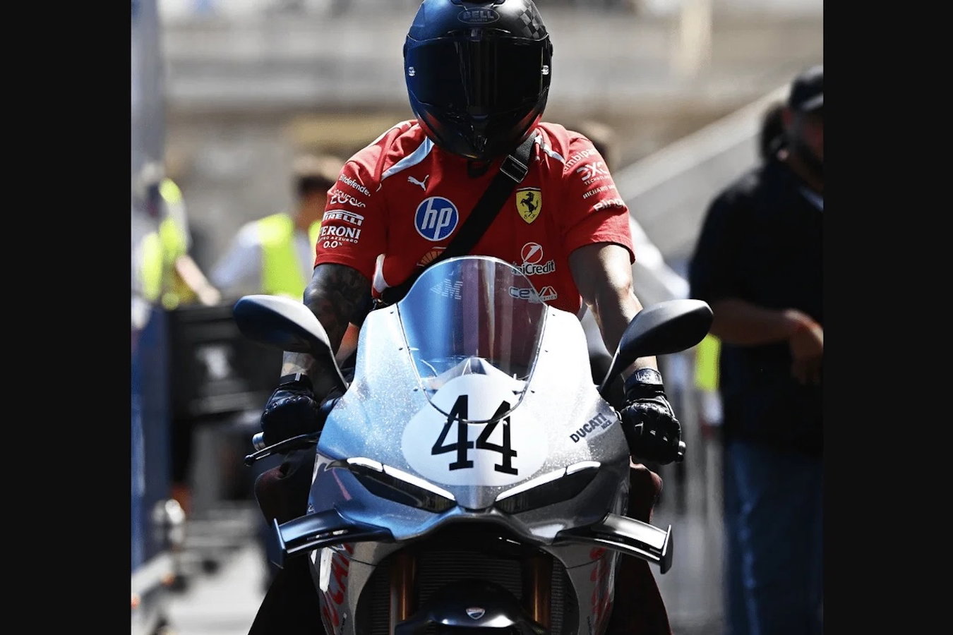 Lewis Hamilton riding a Ducati Panigale V4 S 100