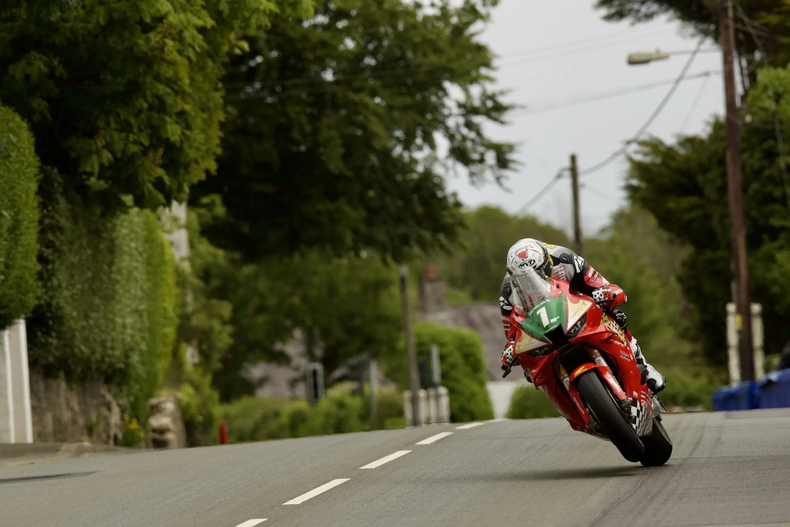 John McGuinness wheelies his Honda of a crest