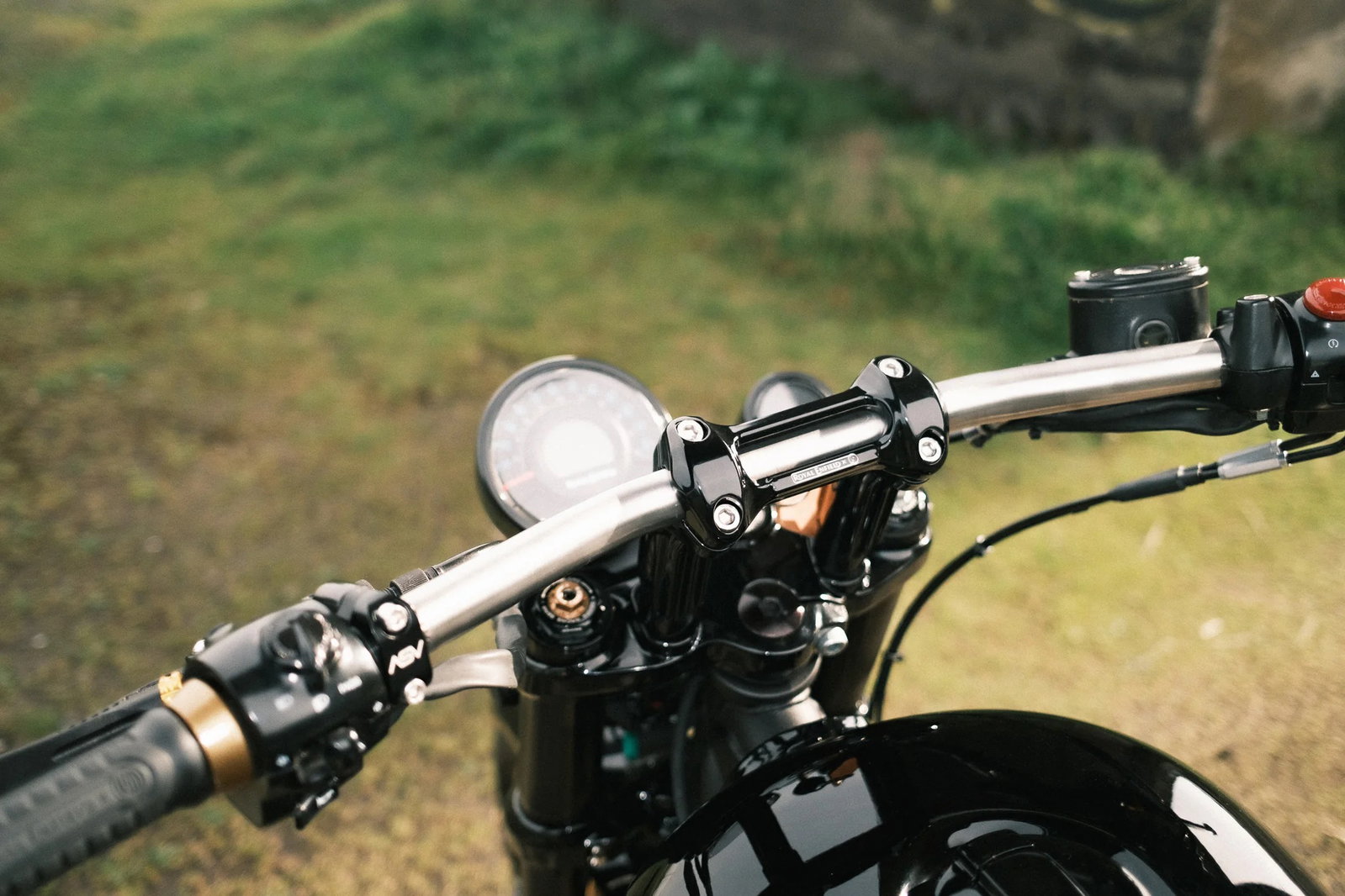 The custom made bar risers give the bike a very different riding position