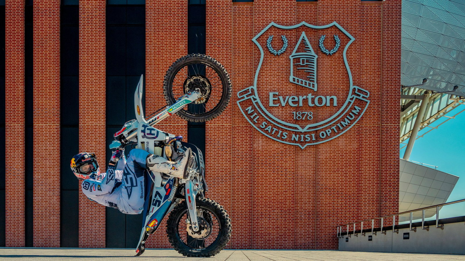 Billy Bolt performing a wheelie outside the new Everton stadium