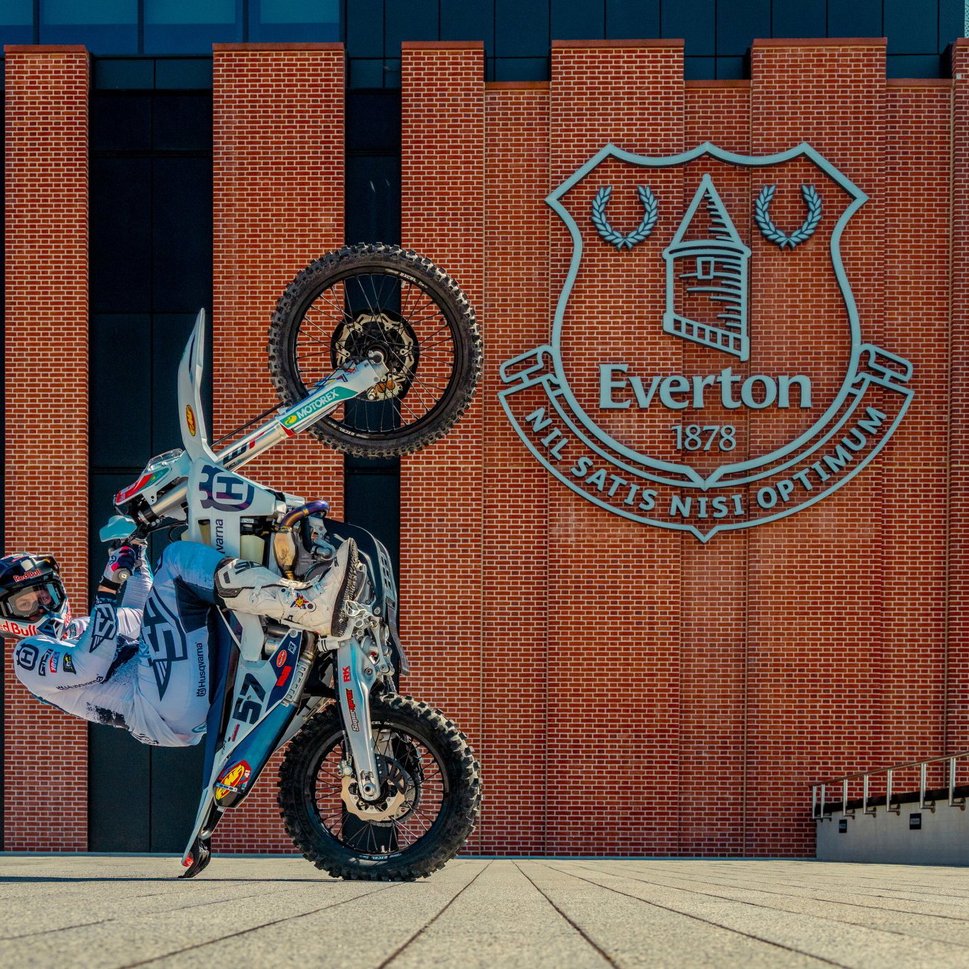 Billy Bolt performing a wheelie outside the new Everton stadium