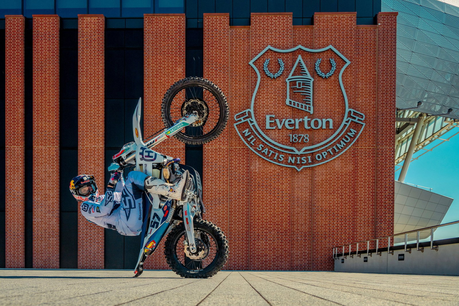 Billy Bolt performing a wheelie outside the new Everton stadium
