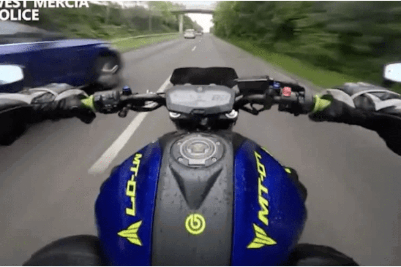 Motorcyclist speeding in the UK.