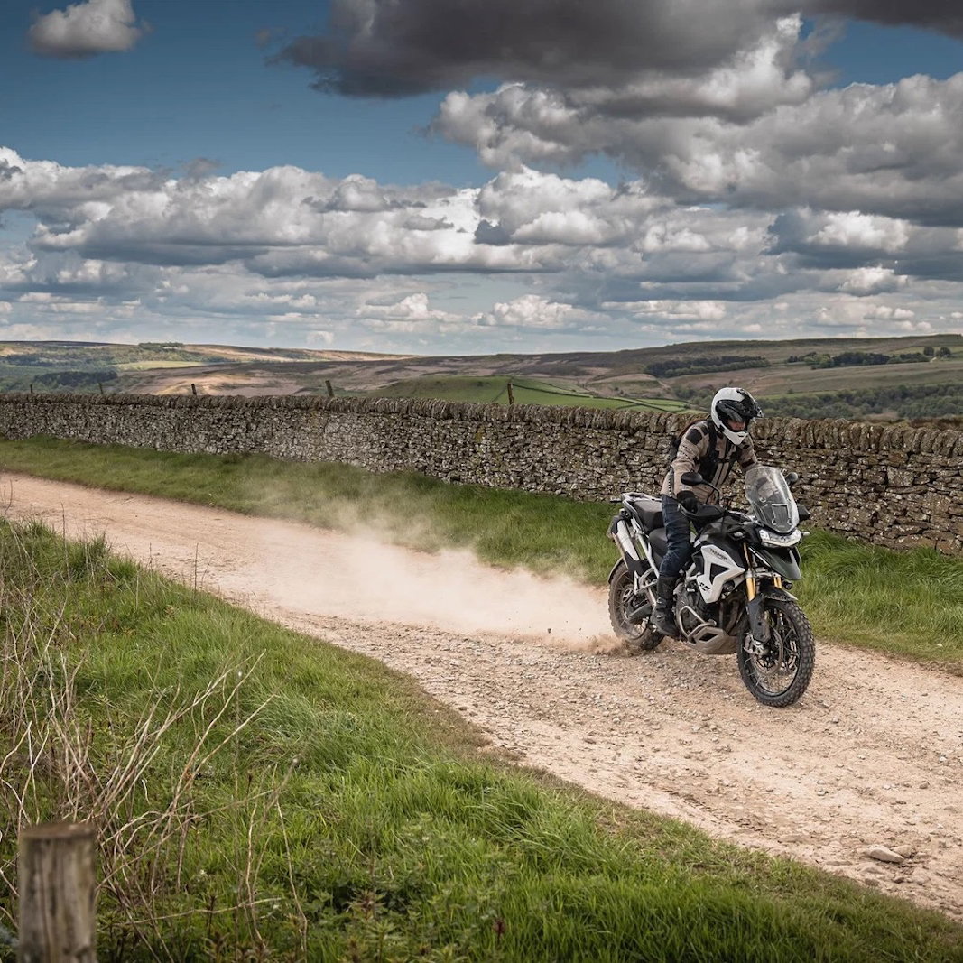 Riding a Tiger 1200 on a green road