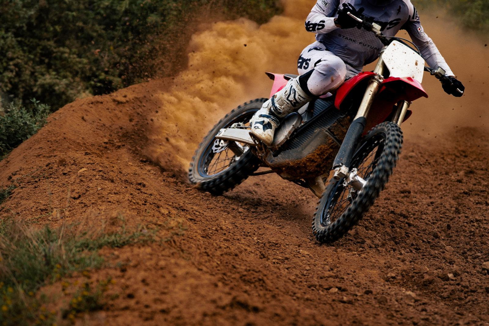 Stark motorcycle riding off-road. 