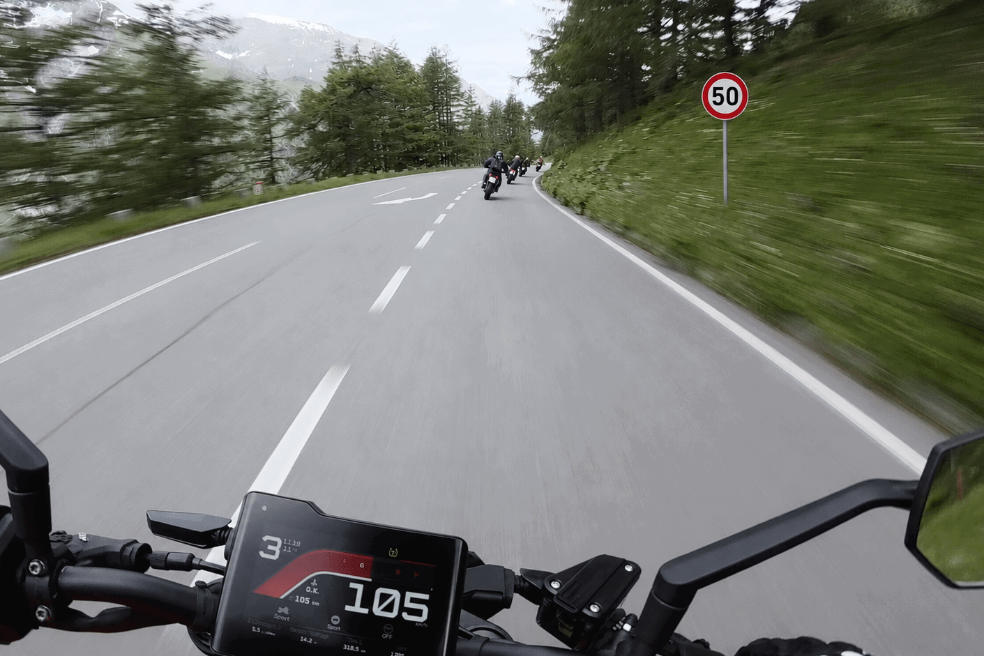 Riding past a 50 speed limit sign