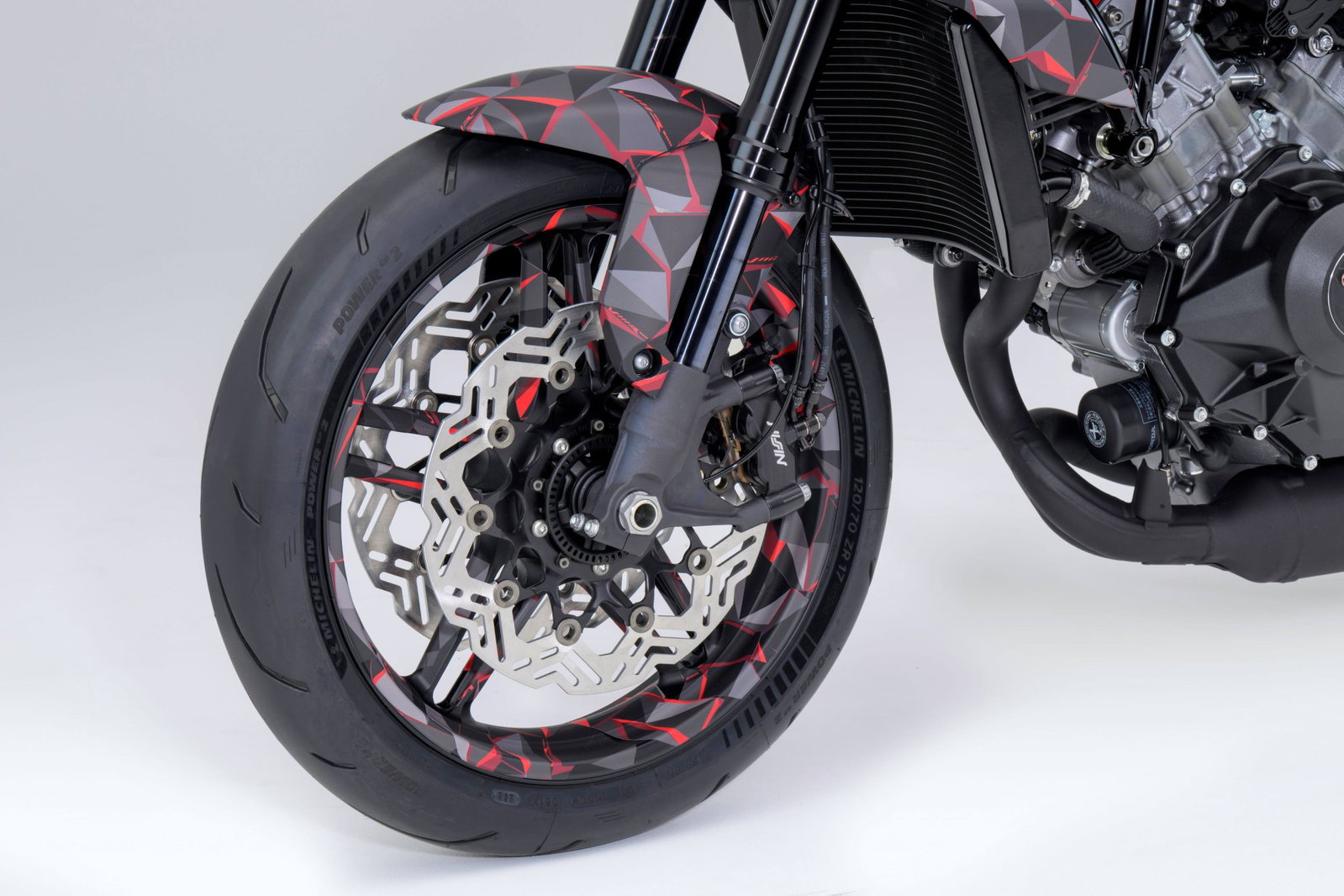 The front and rear brake discs feature an interesting design