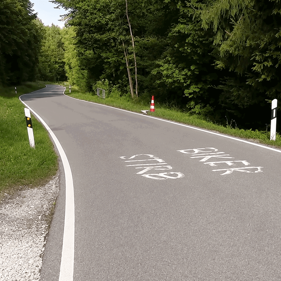 "Biker Stirb" graffiti on a German road