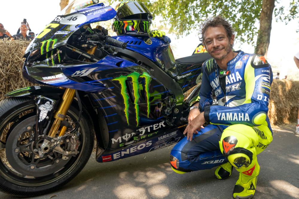 Valentino Rossi next to his 2020 Yamaha MotoGP bike.