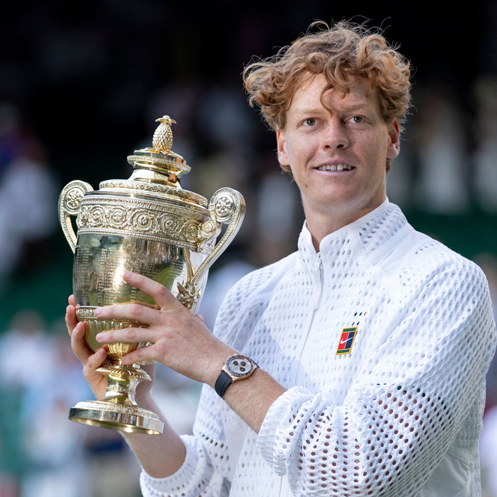 Jannik Sinner holding Wimbledon gentlemen's singles trophy. Credit: Wimbledon.