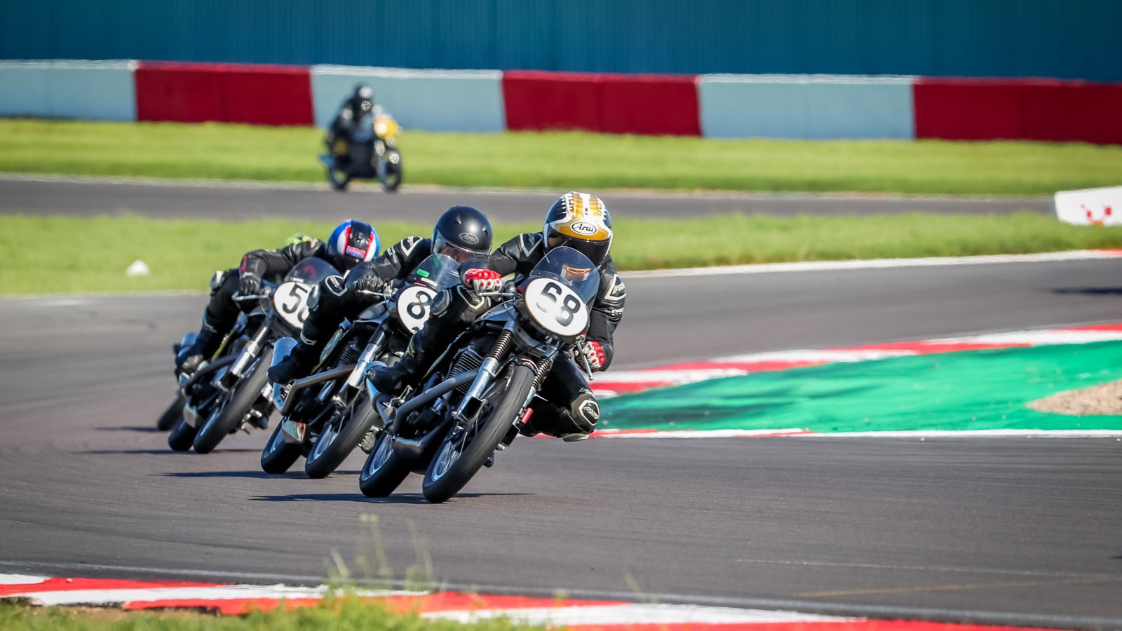 Classic Manx Nortons racing on track