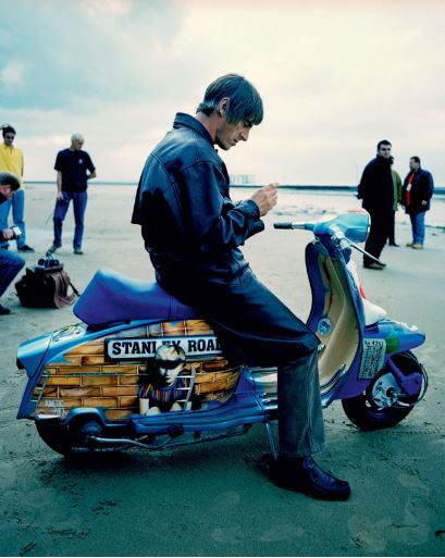 Paul Weller sitting on a scooter