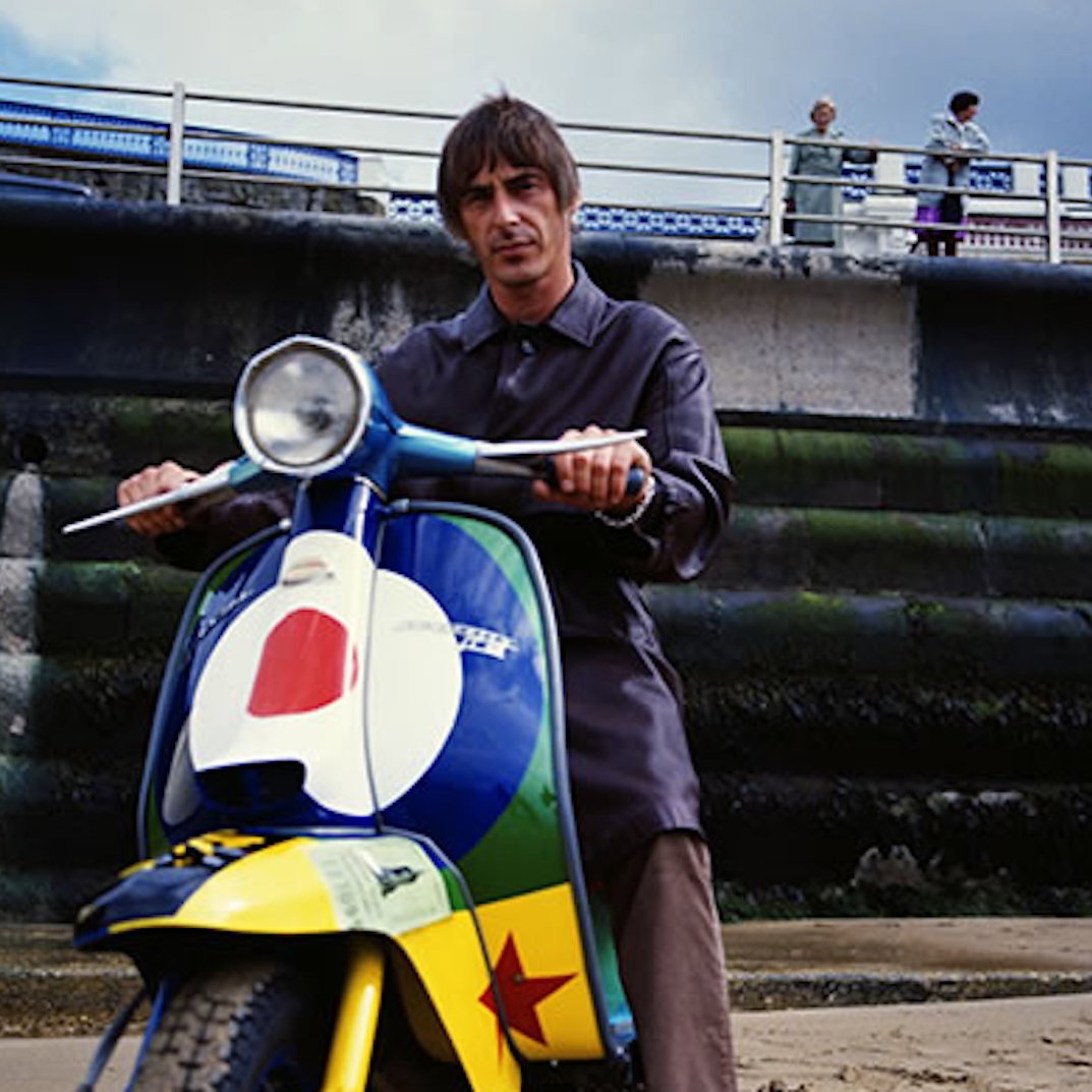 Paul Weller sitting on a his Lambretta Li150 'Stanley Road' scooter