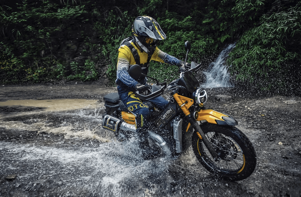 New AJS Leten LT190 riding through water. Credit: AJS Motorcycles.