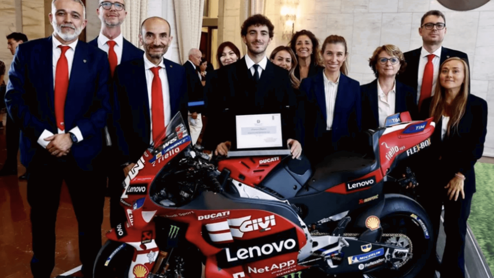 Francesco Bagnaia alongside Ducati CEO Claudio Domenicali.