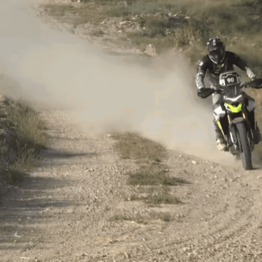 A motorcycle racing at the Baja Espana-Aragon rally.