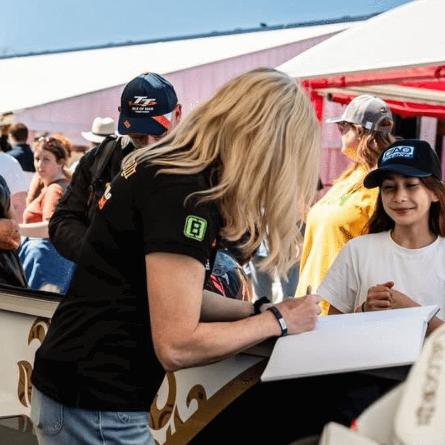 Maria Costello with a fan at the Isle of Man TT. Credit: Maria Costello/Facebook.