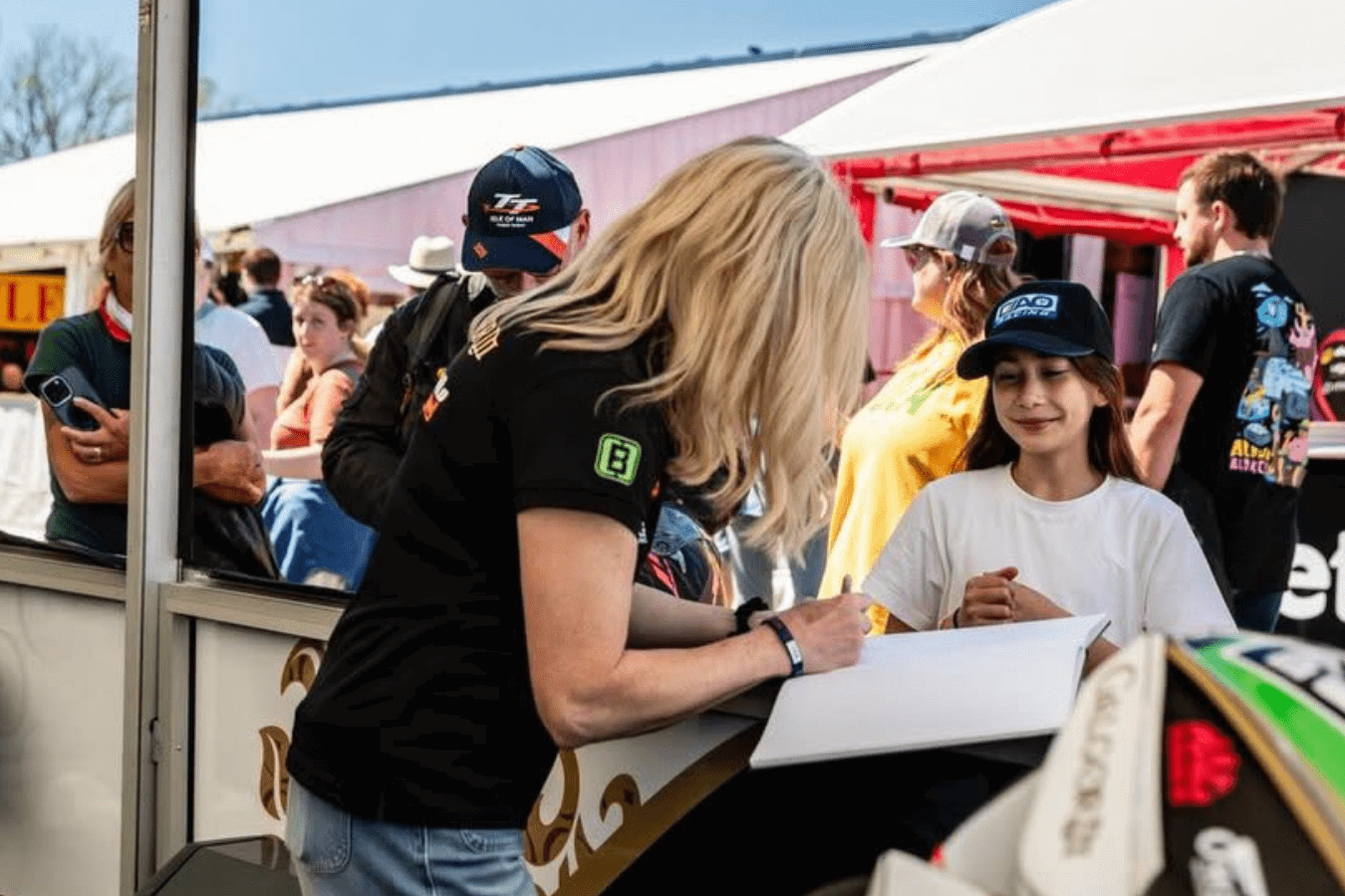 Maria Costello with a fan at the Isle of Man TT. Credit: Maria Costello/Facebook.