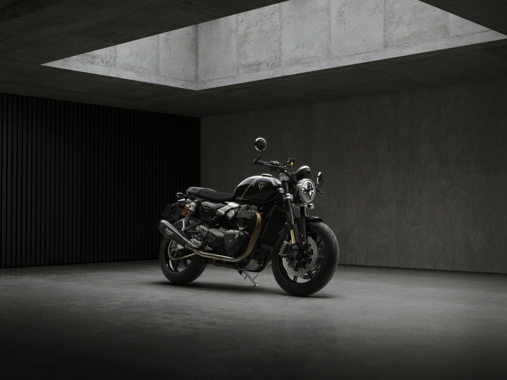 Triumph Speed Twin 1200 TFC wears a black livery with gold accents.