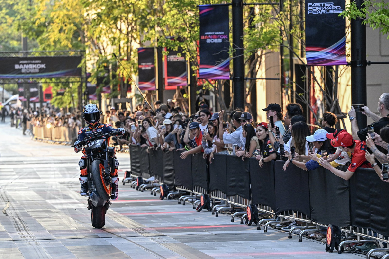 Pedro Acosta pulling a wheelie at the 2025 season launch.