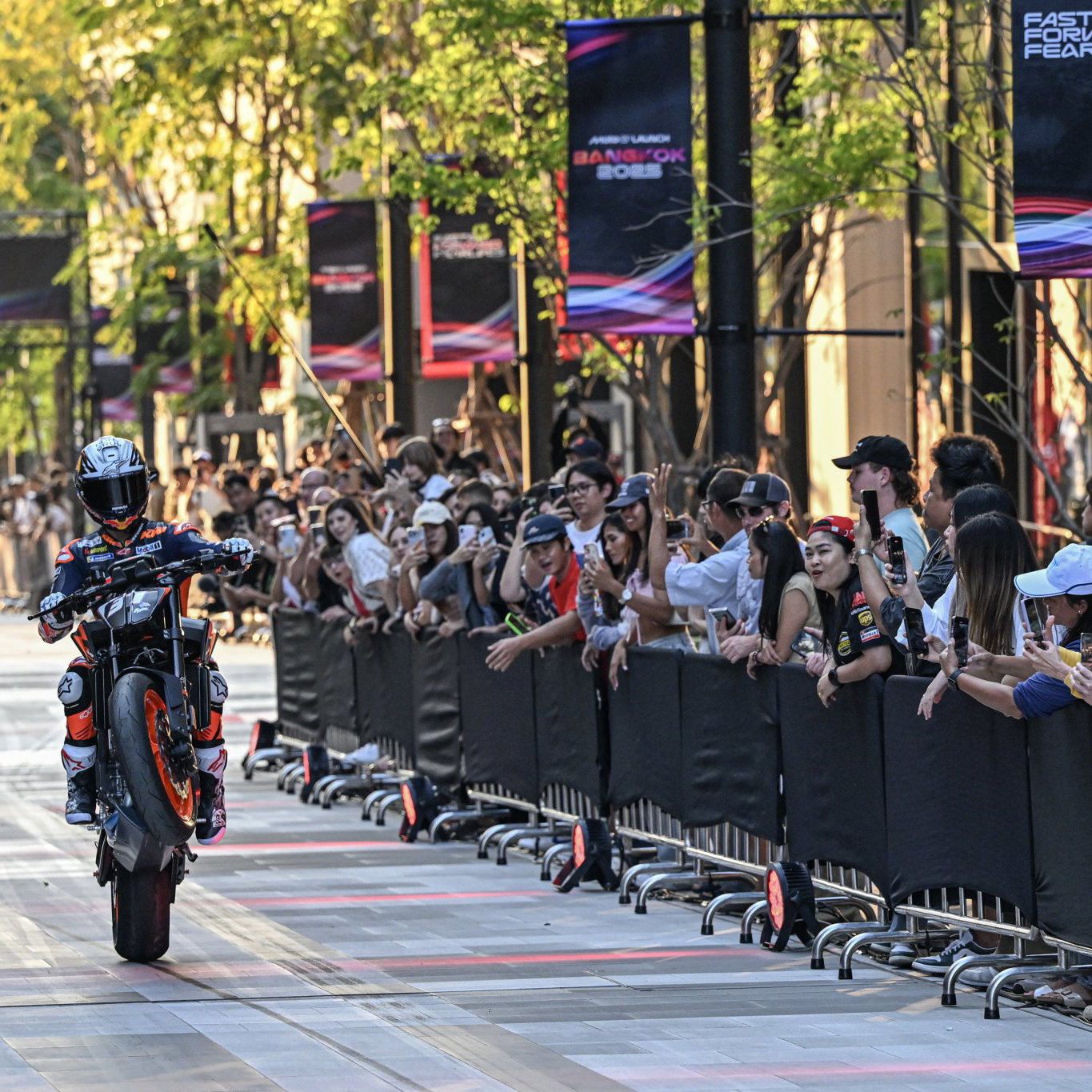 Pedro Acosta pulling a wheelie at the 2025 season launch.