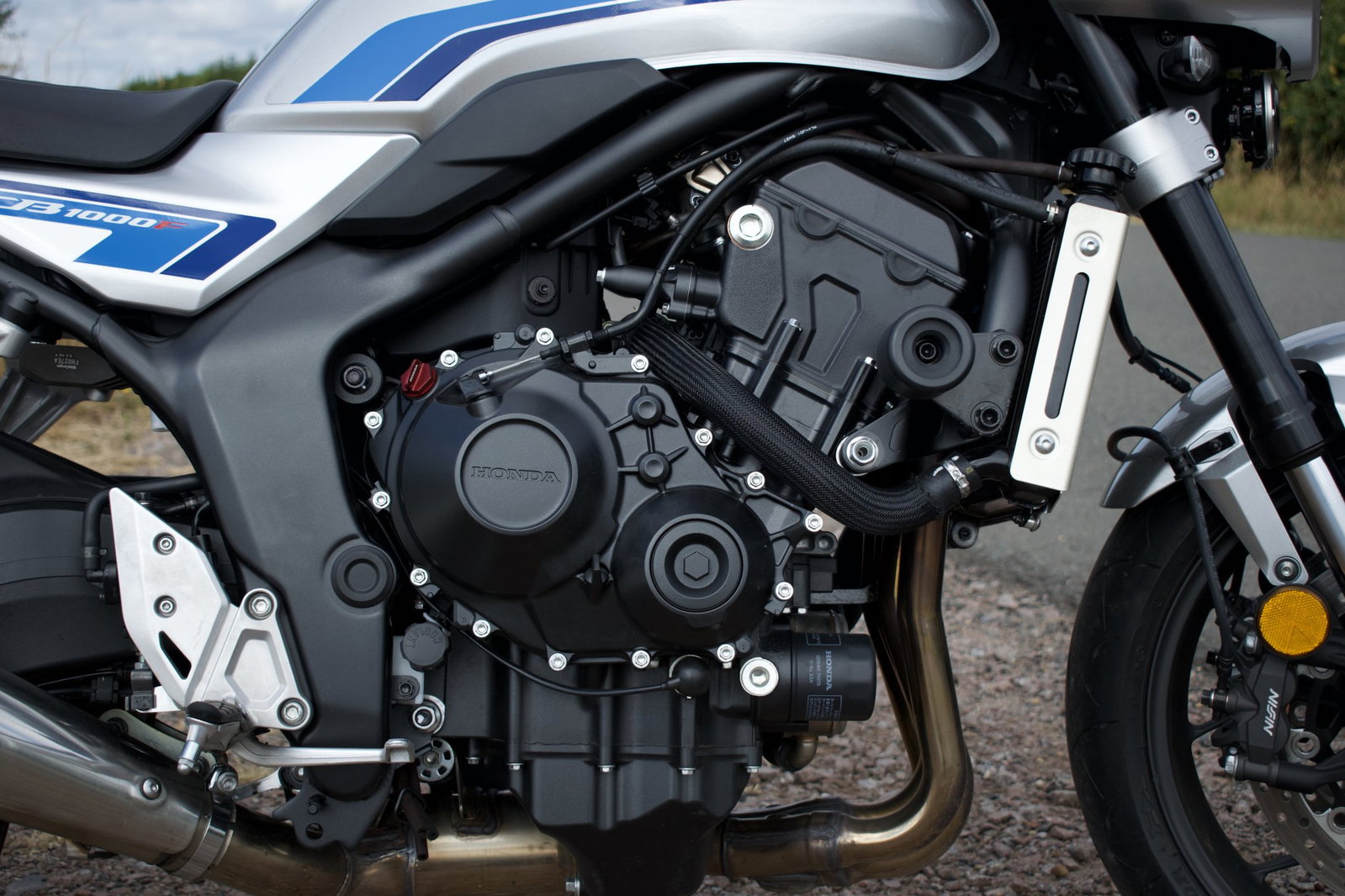 The engine of the CB1000F is heavily revised, mechanically and electronically