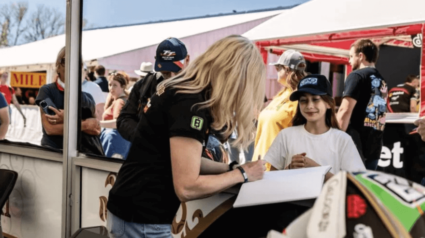 Maria Costello at the Isle of Man TT with a fan. Credit: Maria Costello/Facebook