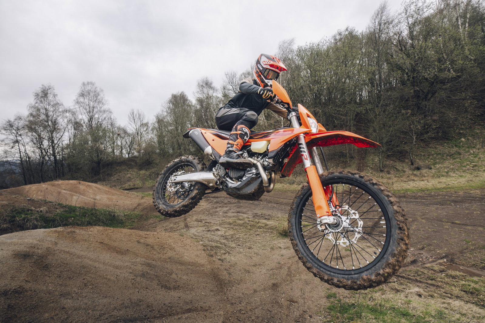 A 2027 KTM enduro motorcycle airborne.