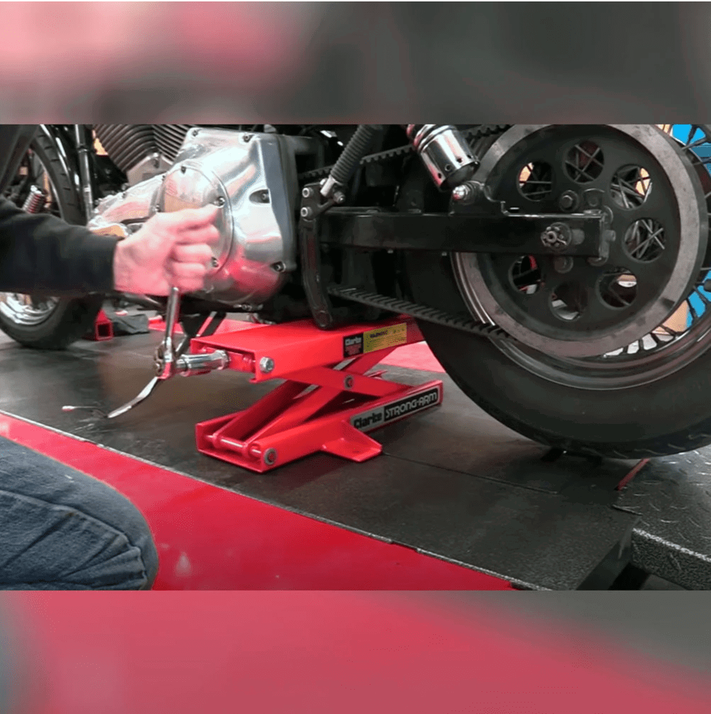 The Clarke CML6 500kg Mechanical Motorcycle Table Lift being used on a bike.
