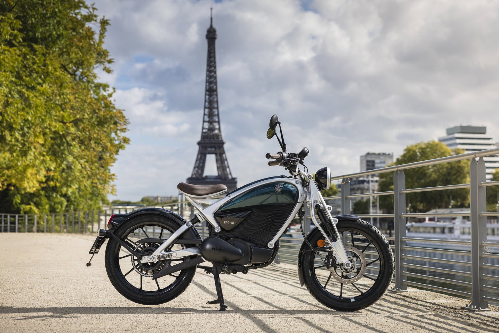 Royal Enfield Flying Flea in front of the Eiffel Tower in Paris.