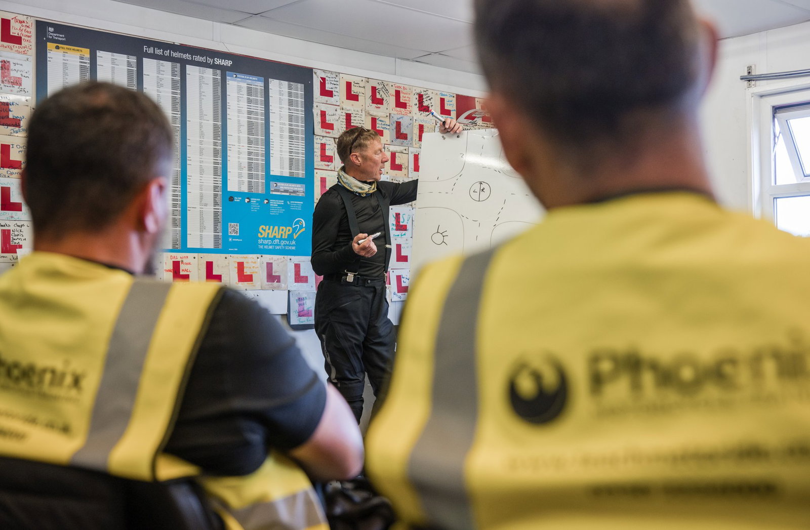 Motorcycle training taking place in a classroom